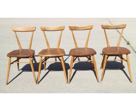 A set of four 1960s Ercol 392 stick back stacking chairs with elm panel seats, on splay supportsCondition: surface scratches,