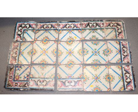 A late 18th century Iznik part panel with floral lattice and scroll borders, comprising fifteen tiles, 8" square