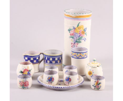 A 1930s Carter Stabler Adams Poole floral decorated cylinder vase, 8 1/2" high, a 1930s Poole floral decorated egg cruet and 