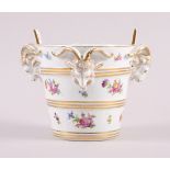 A Dresden porcelain cache pot with ram's head handles and floral decoration, 5 1/2" high