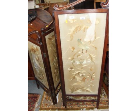 An Edwardian walnut framed four-fold shaped panel screen with silk embroideries, each panel 17" wide