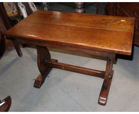 An oak low coffee table, on panel end supports, 30" wide x 15 1/2" deep x 19 1/2" high