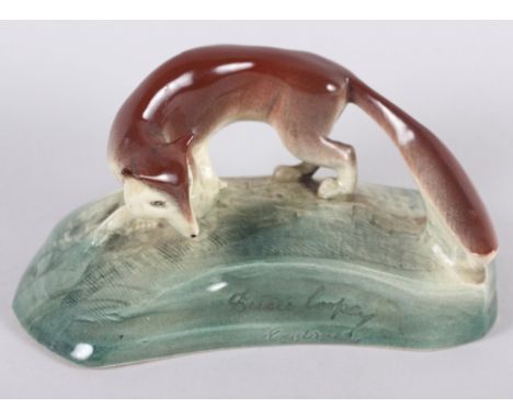 A Susie Cooper ceramic model of a fox, 4" longCondition: Chip to inside rim of base, restorations to right ear, otherwise goo