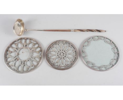 Two silver mounted glass coasters, another similar and a Georgian silver toddy ladle with turned whale bone handle