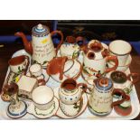 A collection of twenty-five pieces of early 20th century Motto Ware, including inkwell, vesta