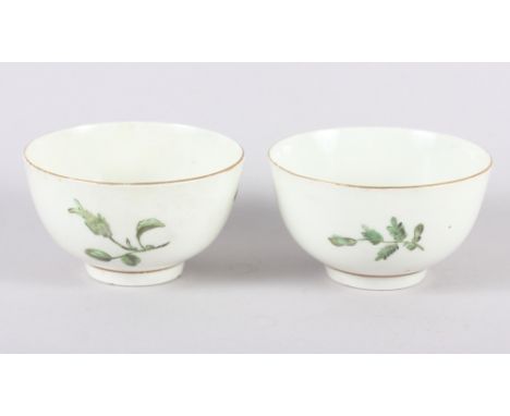 Two 18th century Worcester tea bowls with hand-painted foliage decoration