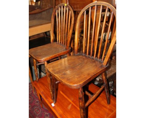 Four Windsor spindle back dining chairs with panel seats