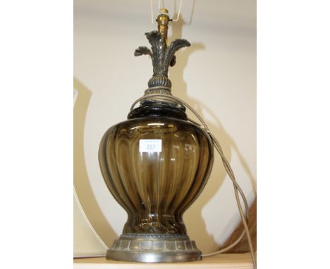 A smoky glass table lamp with metal acanthus leaf design, 24" high