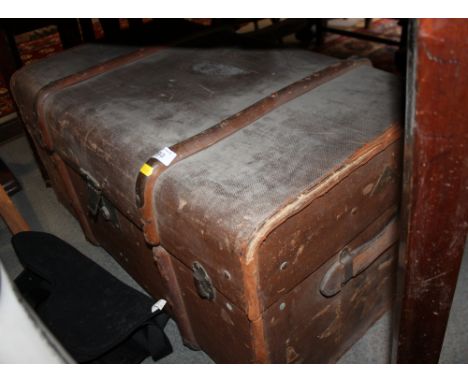 A canvas travelling trunk with wooden and metal fittings, 32" wide and a metal strong box