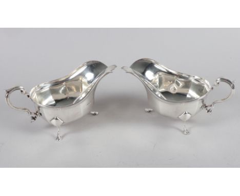 A pair of silver sauce boats with scrolled handles and a pair of Scottish silver sauce ladles, 17.5oz troy approxCondition: 1