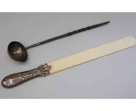 An ivory page turner with embossed white metal handle and a Georgian silver toddy ladle with twisted whale bone handle