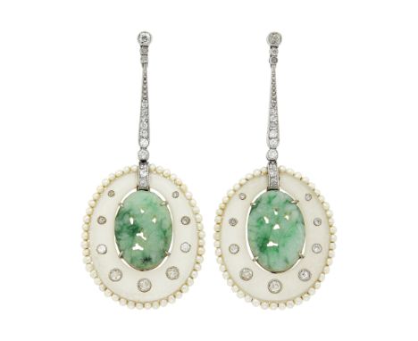 2 oval frosted rock crystals ap. 29.0 x 24.0 mm., 2 oval carved cabochon jade ap. 17.0 x 11.8 x 3.6 mm., small old-mine cut d