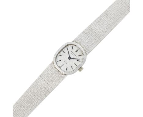 Estate / Collection: The Estate of Gloria Naftali18 kt., mechanical, cushion-shaped textured dial with baton markers, case di