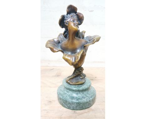An early 20th century Art Nouveau bronze figure modelled as female figure emerging from a flower, attributed to Henri Godet (