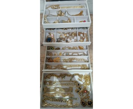 A jewellery box containing mainly gold plated vintage jewellery.  