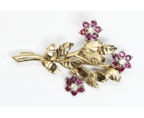 A hallmarked 9ct gold diamond and ruby brooch, length 34mm, gross weight 3g.  