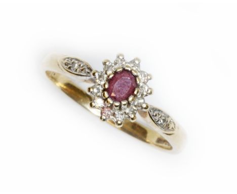 A hallmarked 9ct gold diamond and ruby cluster ring, gross weight 1.8g, size J.  