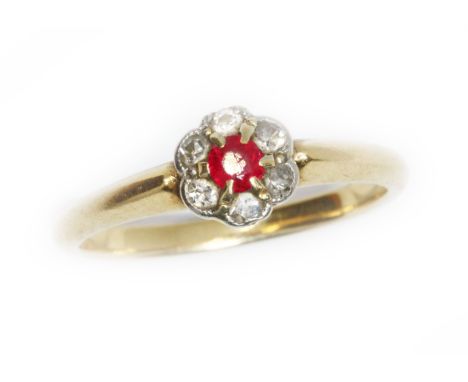 An antique diamond and ruby cluster ring, the daisy head cluster measuring approximately 6.48mm, marked '18ct', gross weight 