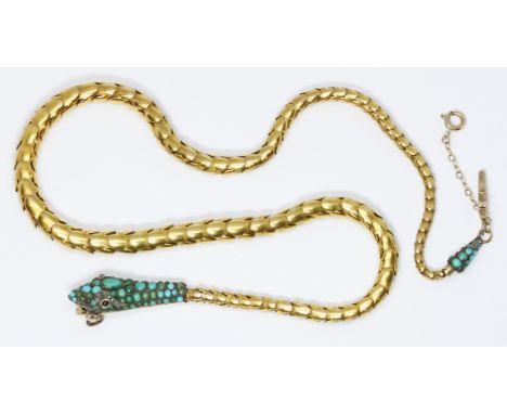 A Victorian serpentine necklace, circa 1860, the snake head set with turquoise cabochons, one ruby and one garnet for eyes an