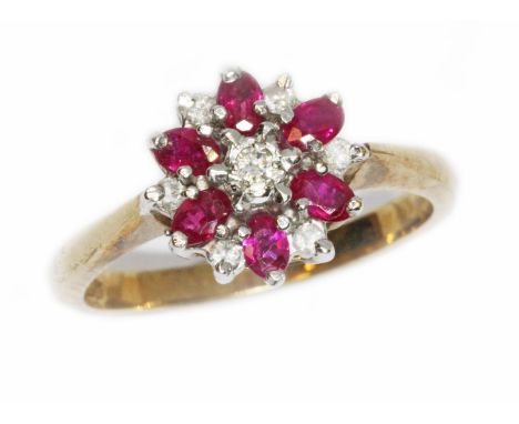 A 9ct gold diamond and ruby ring, International Convention marks, gross weight 3g, size N.  Condition - good, minor wear.