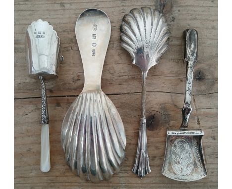 A group of four assorted hallmarked silver caddy spoons, various dates and makers, 19th century and later, lengths 11 to 12.5