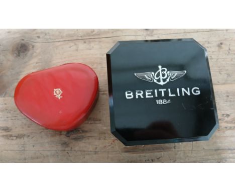 Two watch boxes: Rolex Tudor and a Breitling bakelite watch box.  