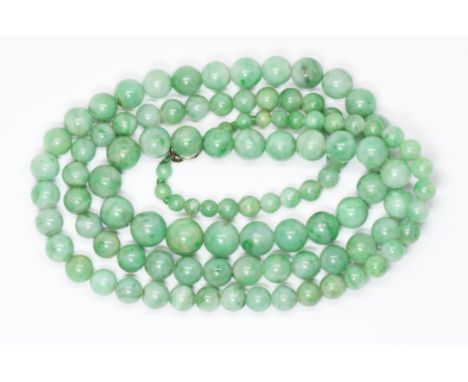 A graduated jadeite jade bead necklace, the beads ranging in diameter from 4.25mm to 9.70mm, length 72cm.  