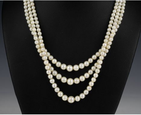 A triple strand cultured pearl necklace mid-century, the pearls graduated from 3mm. to 7.5mm., with silver and marcasite clas