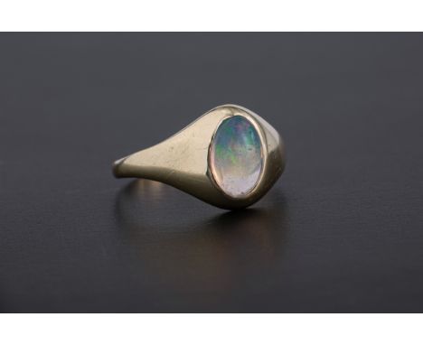 An 18ct gold and water opal ring with 8 x 5mm. opal, size J½.  