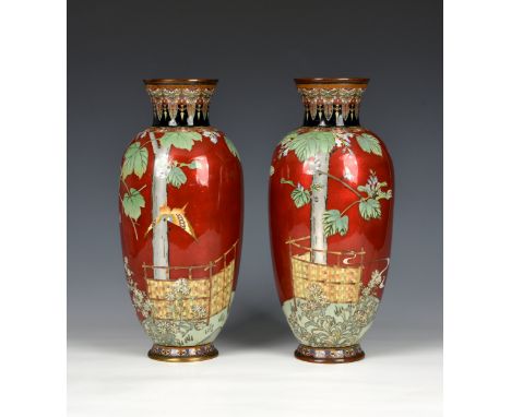 A pair of Japanese red ground cloisonné vases Meiji period (1868-1912), unmarked, of slender ovoid form with waisted neck, th