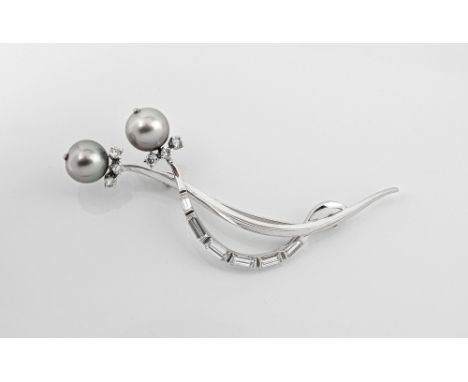 An 18ct white gold, grey South Sea pearl and diamond brooch with two 10.5mm. South Sea pearls, six brilliant cut diamonds and