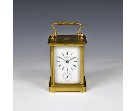 A gilt brass carriage clock with alarm, retailed by Henry Marc, Paris circa 1890, with Corniche case, white Roman enamel dial