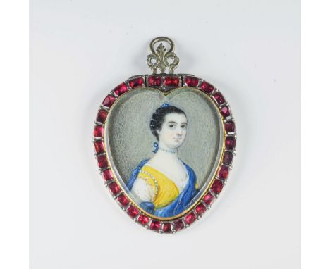 An 18th century heart shaped gold, silver and ruby portrait pendant probably Continental, the portrait of a young lady in wat