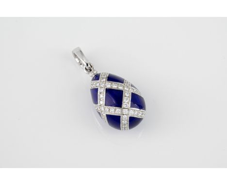 A Faberge 18ct white gold, enamel and diamond egg pendant ltd. ed. 173 of 500, the deep blue enamel egg with lattice decorati