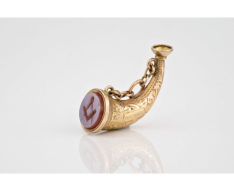 A 9ct gold Masonic bugle brooch hallmarked Birm. 1900, with agate seal.  