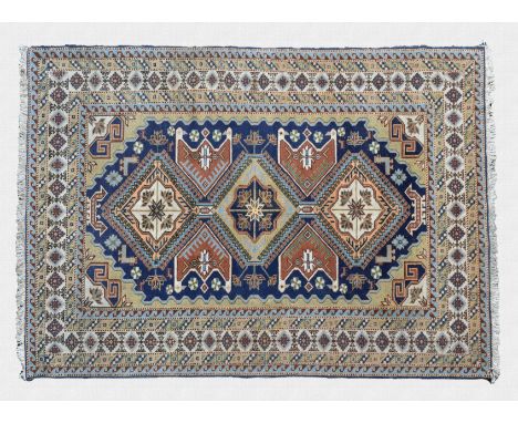 A Shirvan rug mid-20th century, the triple hooked lozenge medallions on a Royal blue field with outer double bird's head meda