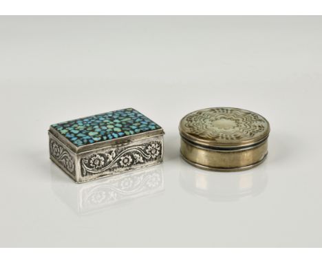 Two silver trinket boxes the first of rectangular form, the hinged cover inset with turquoise mosaic, the sides with engraved