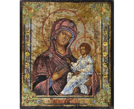 A Russian icon - The Tikhvinskaya Mother of God probably 20th century, showing The Mother of God holding in one arm the Chris