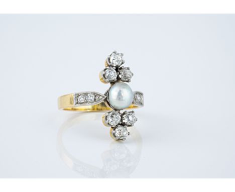 An antique 18ct gold, pearl and diamond ring the central pearl with trios of old cut diamonds above and below, over shoulders