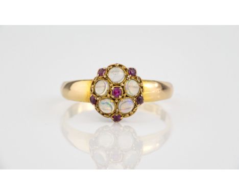 A Victorian 18ct gold, opal and ruby floral cluster ring hallmarked Birm. 1870, size O.  