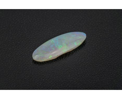 A loose, unmounted opal of elongated elliptical form, 21.5 x 7.9mm., 3.28ct.  