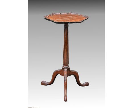 A George II style mahogany tripod wine table c.1900, the rounded hexagonal top with Chippendale beaded rim, on a reeded taper