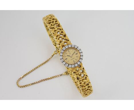 A ladies Omega 18ct gold and diamond cocktail watch 1960s-70s, the 10.5mm. gold dial with raised black and gold baton markers