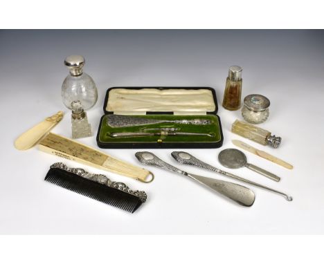 Five silver mounted cut glass dressing table bottles including two scent bottles, late-Victorian to 1920s; together with a si