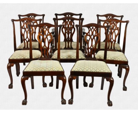 A set of eight Chippendale style mahogany dining chairs 1920s, including a pair of carvers, the scroll carved yoke top rails 