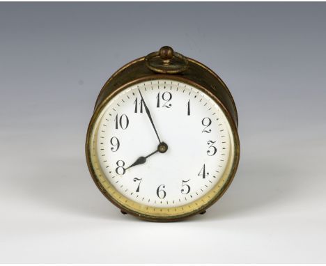 A small brass cased drum clock early 20th century, the Arabic enamel dial with bevelled glass, within a gilt brass case with 