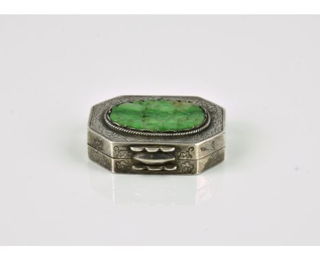 A Chinese silver and jade pill box probably early 20th century, of rectangular form with canted corners, with an applied oval