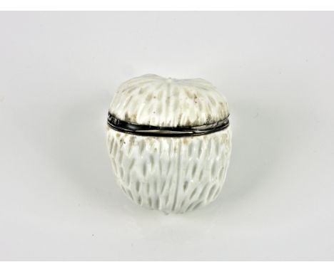 A Victorian novelty silver mounted white porcelain walnut snuff box probably German, indistinct marks, 2 1/8in. (5.5cm.) high