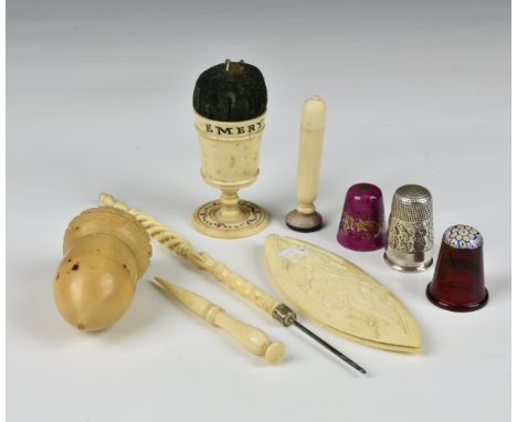 A small collection of antique and vintage sewing accessories comprising a small group of bone items to include a chalice pin 