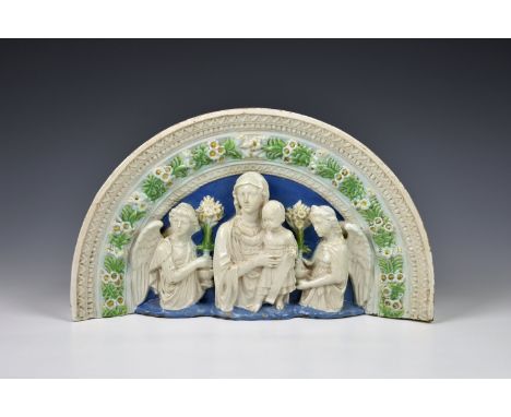 An Italian Cantagalli plaque in the manner of Della Robbia, glazed terracotta, of arched from, depicting the Madonna and Chil